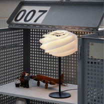 Le Klint Swirl Table Lamp on Desk